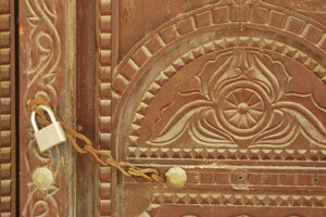 Traditional carved wooden door in Sur, Oman.