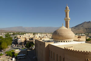 Nizwa mosque, at the foot of the Jebel Akhdar mountains. 